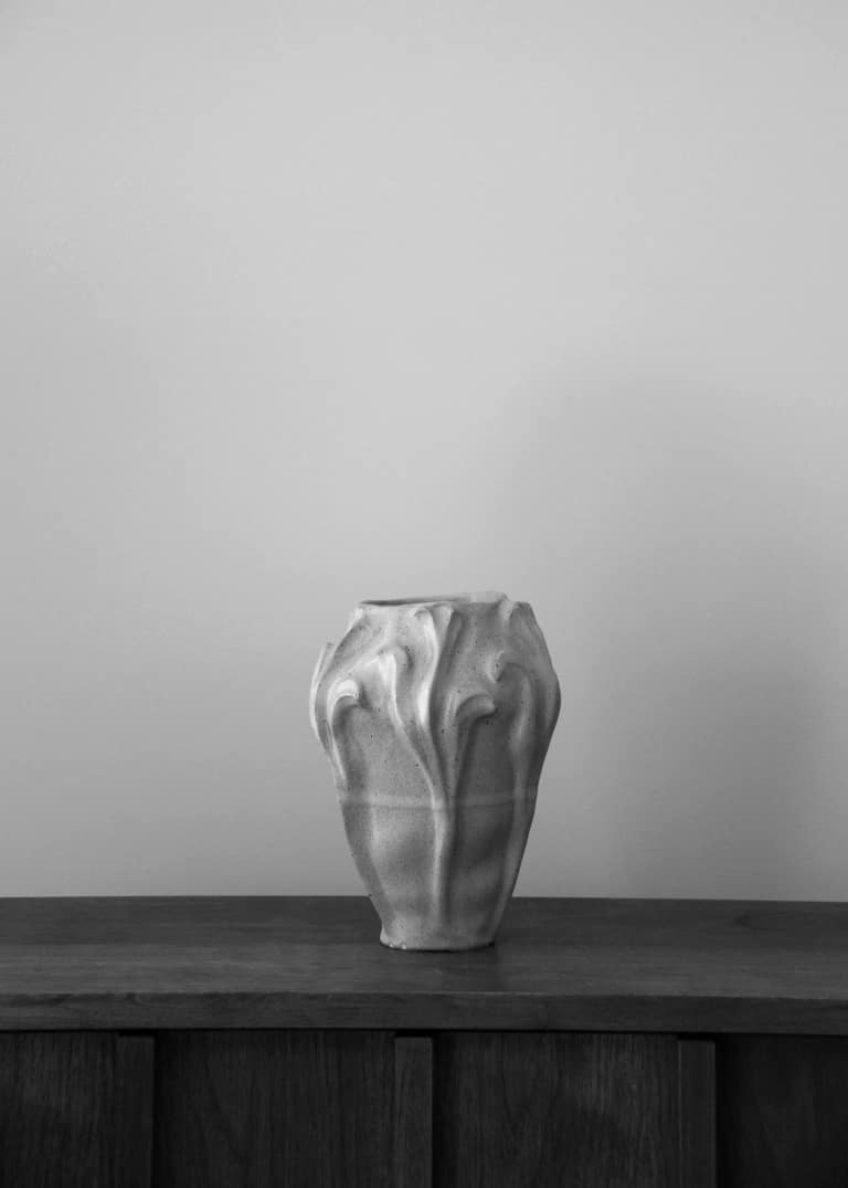 The Floral Vase in speckled glaze, standing on a dark oak sideboard